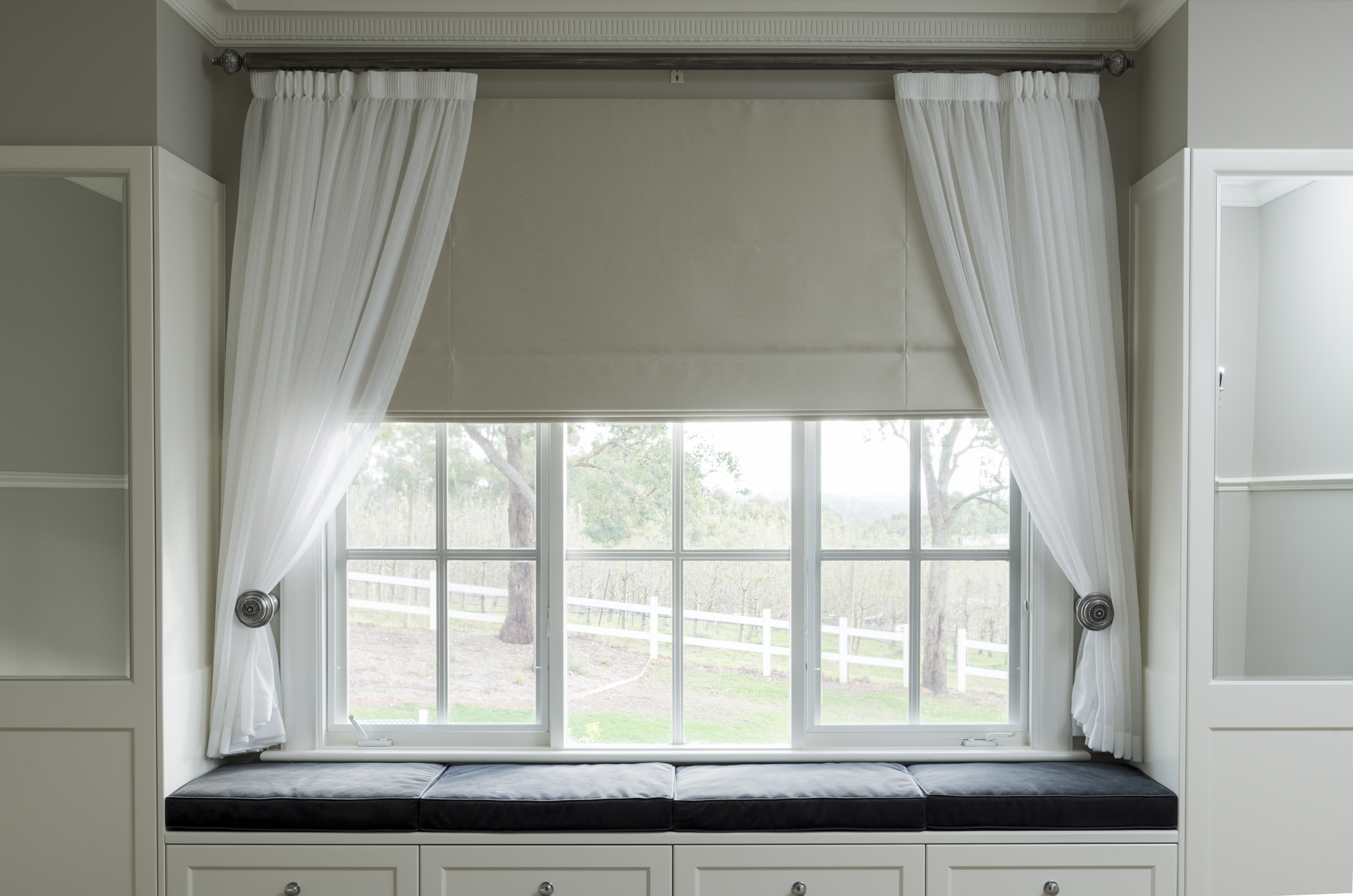 Roman Blind with Pencil Pleat Sheer Curtains in window seat