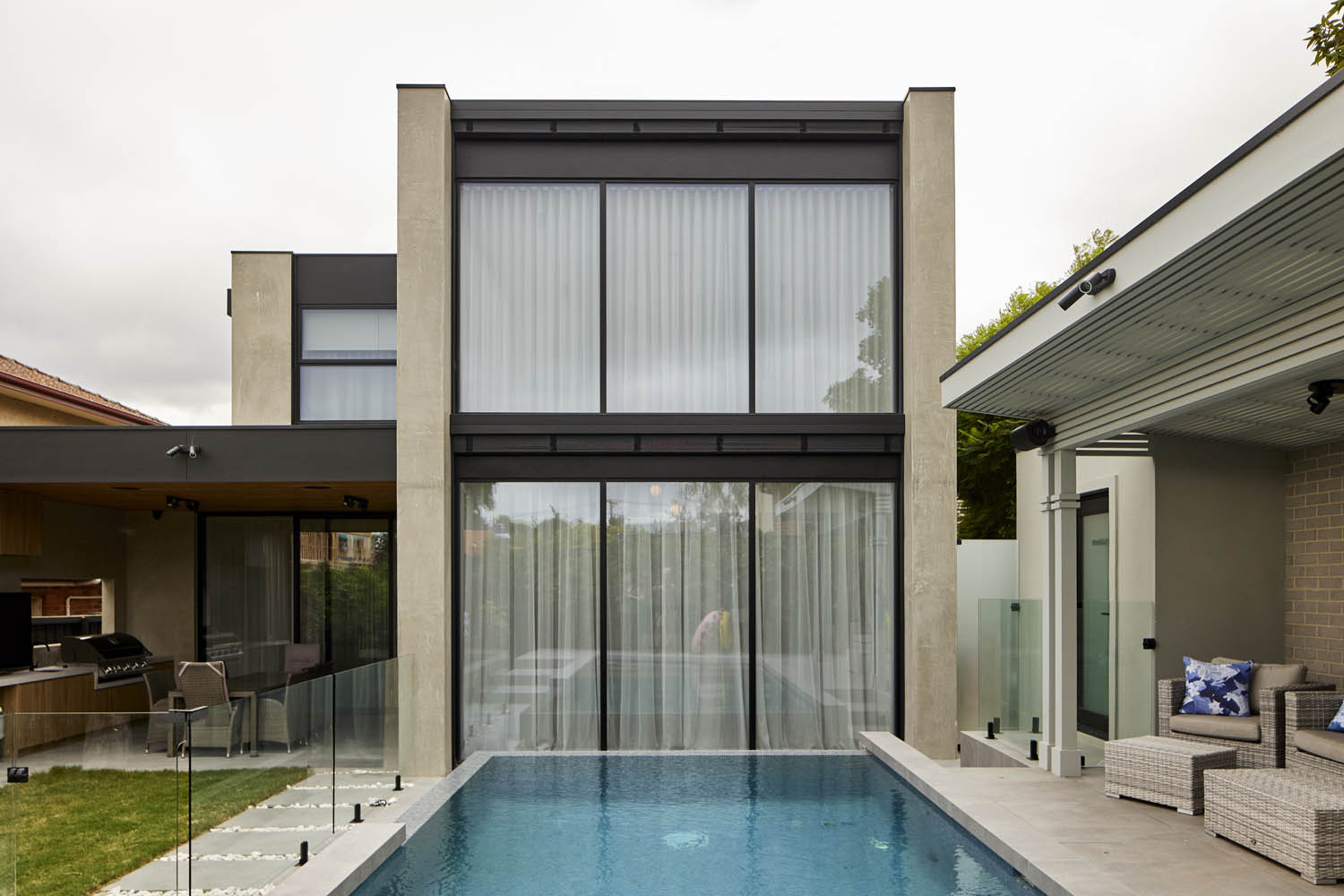 External view of double height Wave Fold Sheer Curtains