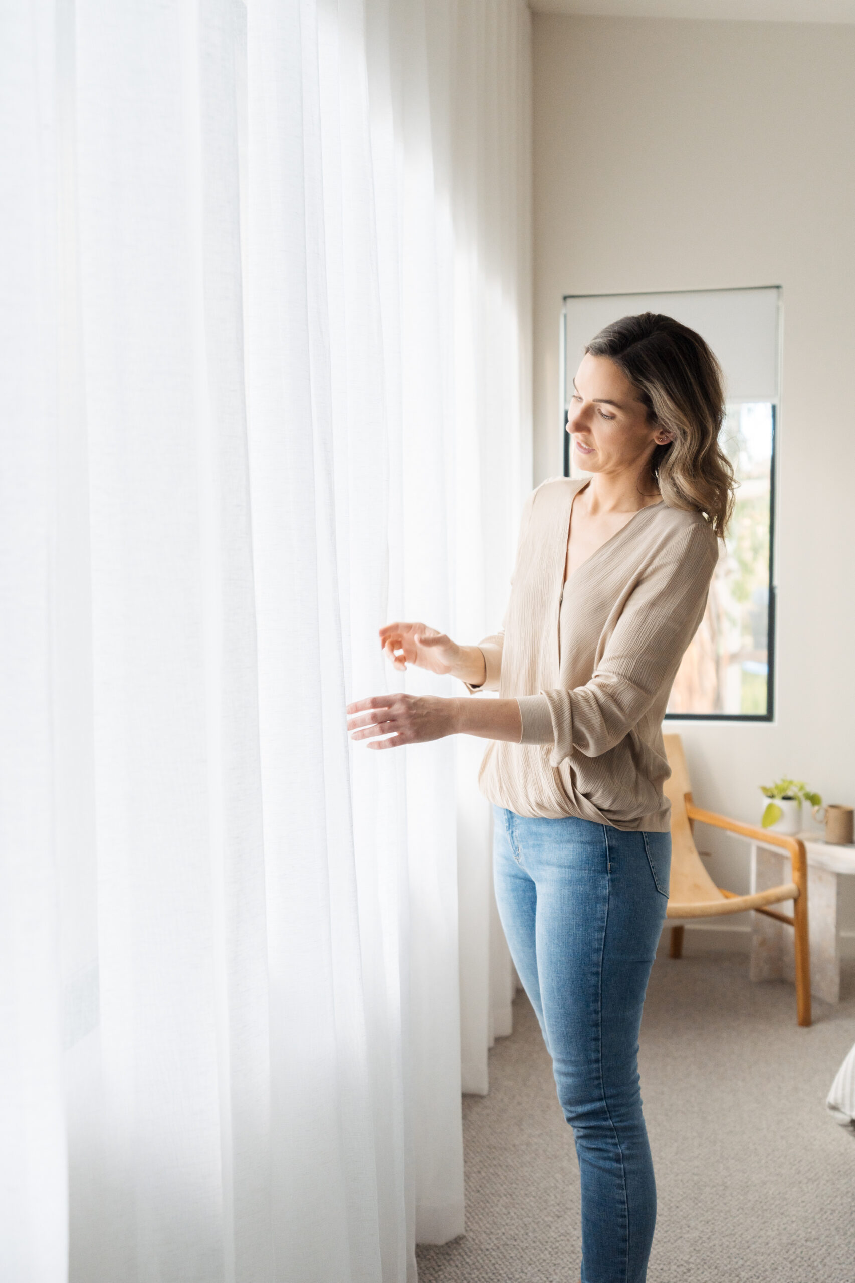 Gina admiring her master bedroom wave fold sheer curtains