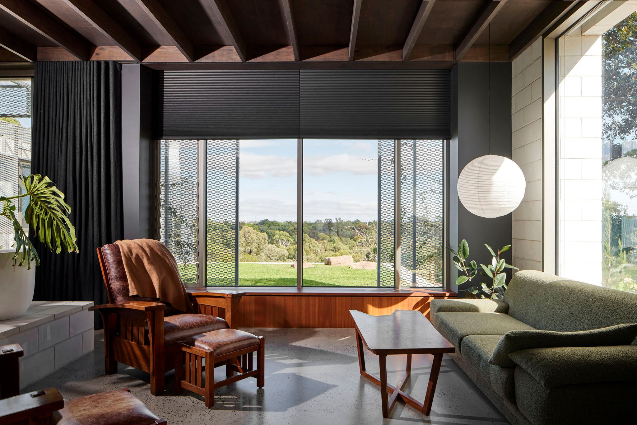 Dark coloured Cellular Blinds opened in a modern living area